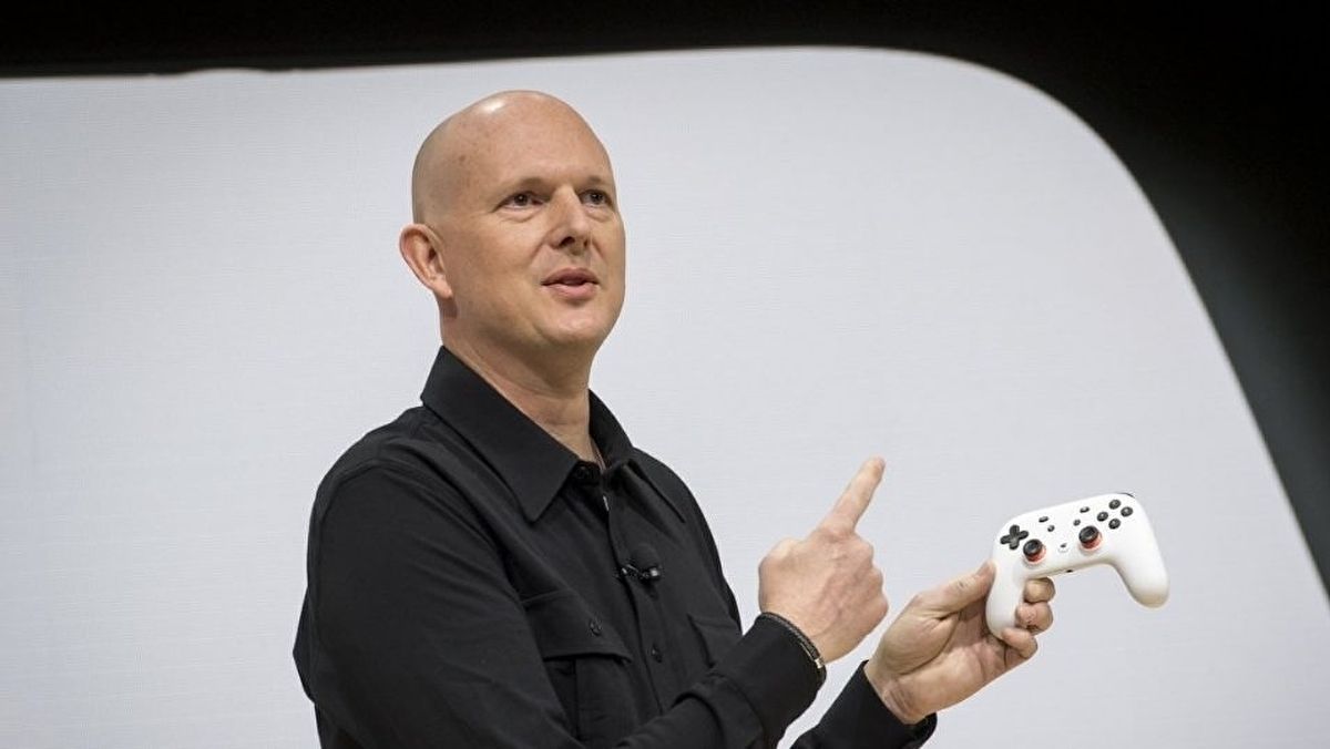 Phil Harrison holding a Google Stadia controller